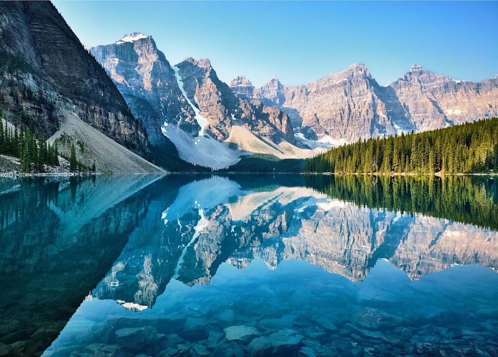 Snow-capped Canadian Rocky Mountains reflected in a lake